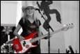 A person in a cowboy hat playing a guitar

Description automatically generated with medium confidence