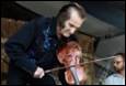 A person playing a violin

Description automatically generated with medium confidence