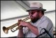 A person playing a trumpet

Description automatically generated with medium confidence
