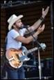 A picture containing person, clothing, concert, musical instrument

Description automatically generated