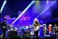 A group of people playing instruments on stage

Description automatically generated with medium confidence