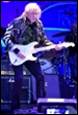 A person playing a guitar

Description automatically generated with medium confidence