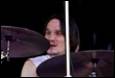 A person playing the drums

Description automatically generated with medium confidence