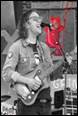 A person playing guitar and singing

Description automatically generated with low confidence
