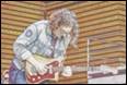 A person playing a guitar

Description automatically generated with medium confidence