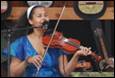 A person playing a violin

Description automatically generated