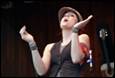 A person with her hands up

Description automatically generated