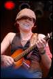 A person playing a guitar

Description automatically generated