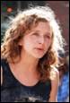 A person with curly hair

Description automatically generated