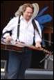 A person playing a guitar

Description automatically generated