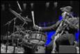 A person playing a drum set

Description automatically generated