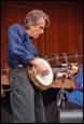 A person playing a banjo

Description automatically generated