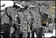 A group of people standing in a line

Description automatically generated