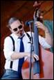 A person playing a bass

Description automatically generated