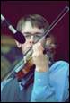 A person playing a violin

Description automatically generated