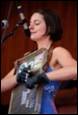 A person playing an instrument

Description automatically generated