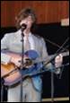 A person playing a guitar

Description automatically generated