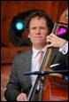 A person playing a cello

Description automatically generated