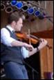A person playing a violin

Description automatically generated