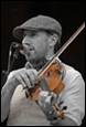 A person playing a violin

Description automatically generated