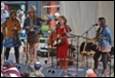 A group of people playing instruments

Description automatically generated