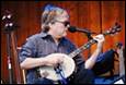 A person playing a banjo

Description automatically generated