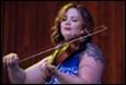 A person playing a violin

Description automatically generated