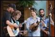 A group of people playing instruments

Description automatically generated