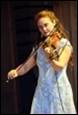A person playing a violin

Description automatically generated