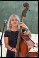 A person holding a cello

Description automatically generated