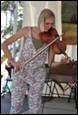 A person playing a violin

Description automatically generated