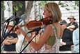 A person playing a violin

Description automatically generated