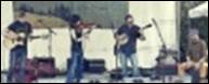 A group of people playing instruments

Description automatically generated