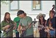 A group of people playing instruments

Description automatically generated