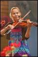 A person playing a violin

Description automatically generated