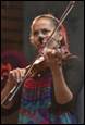 A person playing a violin

Description automatically generated