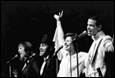 A group of people singing on stage

Description automatically generated with low confidence