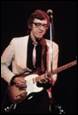 A person playing a guitar

Description automatically generated with medium confidence