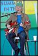 A picture containing clothing, person, microphone, human face

Description automatically generated