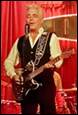 A person playing a guitar

Description automatically generated with medium confidence
