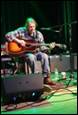 A person playing guitar on stage

Description automatically generated with medium confidence