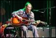 A person playing a guitar

Description automatically generated with medium confidence