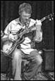 A person playing a guitar

Description automatically generated with medium confidence