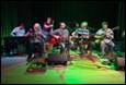 A group of people playing instruments

Description automatically generated with medium confidence