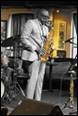 A person playing a saxophone

Description automatically generated with medium confidence
