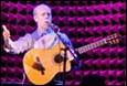A person playing a guitar

Description automatically generated