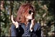A person with red hair and sunglasses

Description automatically generated with low confidence