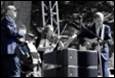 A group of people playing instruments

Description automatically generated with medium confidence