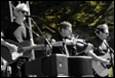 A group of people playing instruments

Description automatically generated with medium confidence