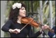 A person playing a violin

Description automatically generated